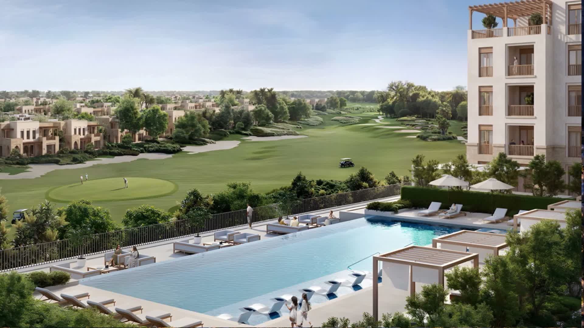 Apartment building, pool terrace and golf course at Damascus Heights, with low-rise homes beyond